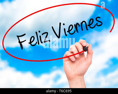 Man main écrit Feliz Viernes (bon vendredi en espagnol) avec marqueur noir sur l'écran visuel Banque D'Images