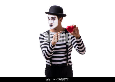 Holding Mime cœur rouge isolé sur fond blanc Banque D'Images