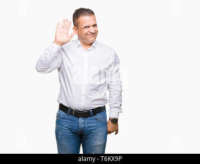 L'âge moyen homme élégant arabes sur fond isolé renonciation disant bonjour heureux et souriant, aimable geste de bienvenue Banque D'Images
