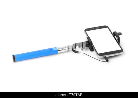 Smartphone avec stick selfies Banque D'Images