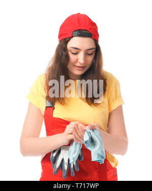 Mécanicien en uniforme féminin d'essuyer les mains sur fond blanc Banque D'Images