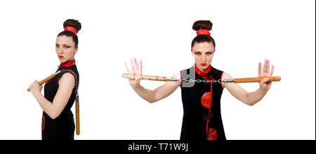 Femme drôle avec nunchucks isolated on white Banque D'Images