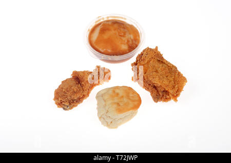 KFC 2 morceaux de poulet frit, le pilon et la cuisse, avec un biscuit et de la purée de pomme de terre et de la sauce Banque D'Images