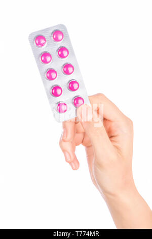 Woman hand holding pills comprimé. Femme hand holding pill prescription sur fond blanc. Banque D'Images