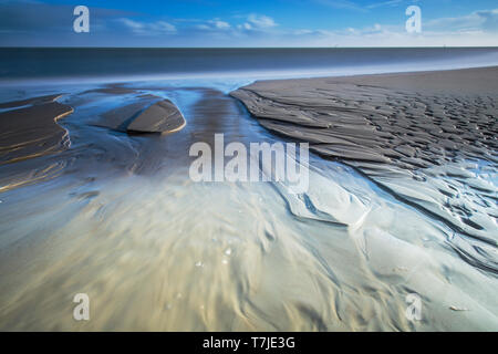 Les modèles sur la plage de sable Banque D'Images
