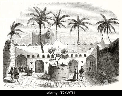 Cour orientaux anciens avec les gens à l'intérieur d'Oman et des palmiers. L'architecture typique de Gadames la Libye. Auteur non identifié par l'éditeur sur le Magasin pittoresque Paris-1848 Banque D'Images