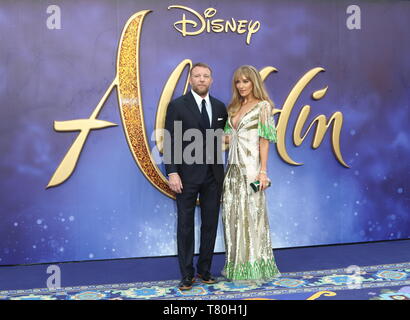 Guy Ritchie et Jacqui Ritchie assiste à la projection de gala de l'Aladdin à l'Odeon Leicester Square Luxe Banque D'Images