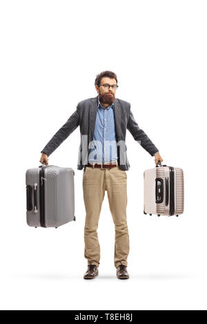 Portrait d'un homme confus holding valises isolé sur fond blanc Banque D'Images