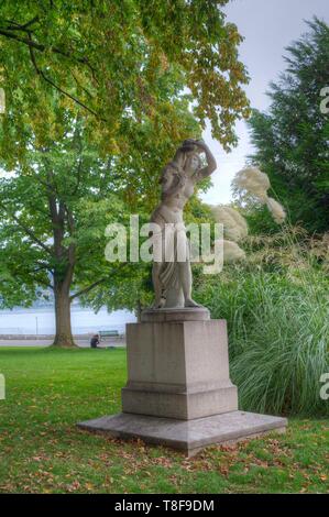 La Suisse, Genève, Suisse, dans le parc mon repos sur les rives du lac Léman, une statue, femme et enfant Banque D'Images