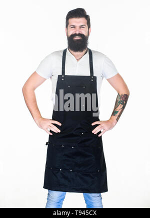 Laisser mon sourire heureux réchauffer votre cœur. Heureux homme portant coiffure ou tablier de cuisine. Homme barbu happy smiling in latzschürze. Hipster brutal avec sourire heureux sur le visage non rasé. Banque D'Images