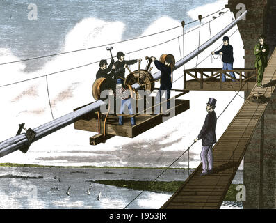 Le tressage des câbles de suspension. Le Pont de Brooklyn est l'un des plus anciens ponts suspendus des États-Unis. Achevé en 1883, il relie les quartiers de Manhattan et Brooklyn en enjambant l'East River. Avec une travée principale de 1 595,5 pieds, c'était le plus long pont suspendu du monde depuis son ouverture jusqu'à 1903, et le premier pont suspendu sur le fil d'acier. Banque D'Images