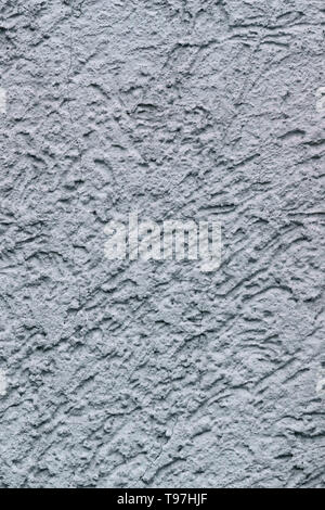 La texture de fond de lumière, de déco, mur de béton texturé présentant des irrégularités et des fissures Banque D'Images
