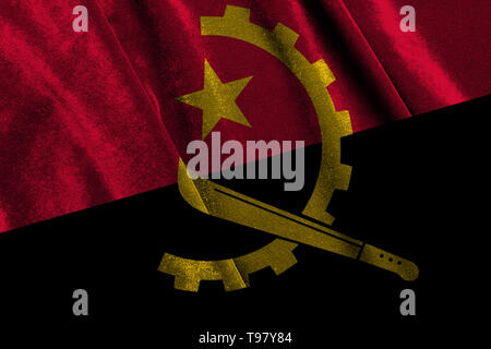 Drapeau Angola arabe détient dans ses mains Banque D'Images