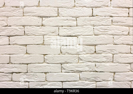 Close-up of white painted mur de briques solides blanchis. Résumé Contexte L'espace de copie, la maçonnerie, la construction et la maçonnerie concept. Banque D'Images