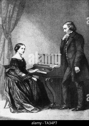 Le compositeur allemand Robert Schumann et sa femme, la pianiste et compositrice Clara Schumann, assis au piano. Banque D'Images