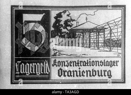 Camp de concentration 5 pfennig argent du camp de concentration d'Oranienburg. Sur le projet de loi ou d'un jeton d'argent est une découpe du camp. Banque D'Images