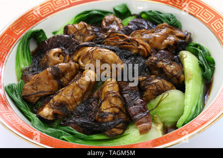 Les huîtres séchées braisées avec mousse noire (ho voir fat choy ) , Nouvel an chinois traditionnels lave Banque D'Images