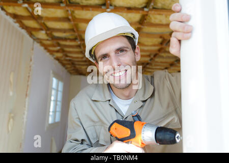Le forage de trous d'hommes builder Banque D'Images