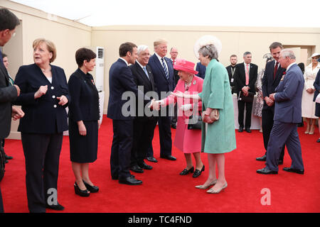 (De gauche à droite) la Chancelière allemande, Angela Merkel, Gouverneur général de la Nouvelle-Zélande Patsy Reddy, président de la France Emmanuel Macron, Président de la Grèce Prokopis Pavlopoulos, le président américain Donald Trump, La Reine Elizabeth II, le premier ministre Theresa May, Secrétaire aux affaires étrangères Jeremy Hunt et le Prince de Galles, lors d'une réunion des dirigeants des nations alliées au 75e anniversaire du débarquement à Southsea Common, Portsmouth. Banque D'Images