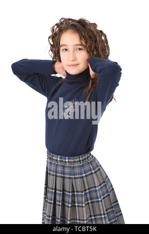 Portrait of smiling adorable petite fille écolière avec curl cheveux isolé sur fond blanc Banque D'Images
