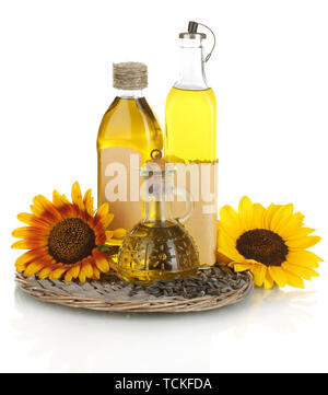 En bouteilles d'huile, le tournesol et graines isolated on white Banque D'Images