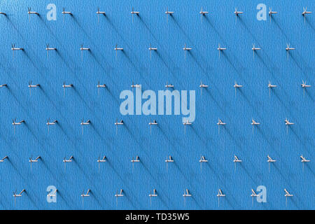 Le rendu 3D d'une vue aérienne des éoliennes dans l'océan Banque D'Images