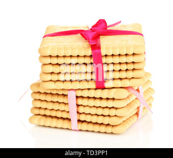 Sweet cookies attachées avec un ruban rose isolated on white Banque D'Images