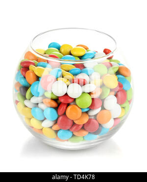 Bonbons colorés dans bol en verre isolated on white Banque D'Images