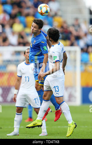 Gdynia, Pologne. 11 Juin, 2019. Danylo Sikan (L) de l'Ukraine est en concurrence pendant la Coupe du Monde FIFA U20 match de demi-finale entre l'Ukraine et l'Italie à Gdynia, Pologne, 11 juin 2019. L'Ukraine a gagné 1-0 pour entrer dans la finale. Credit : Piotr Matusewicz/Xinhua/Alamy Live News Banque D'Images