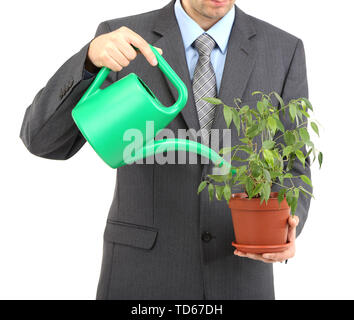 Jeune homme d'arrosage pot isolated on white Banque D'Images