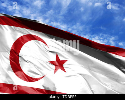 Waving Flag de la République turque de Chypre du Nord close up against blue sky Banque D'Images