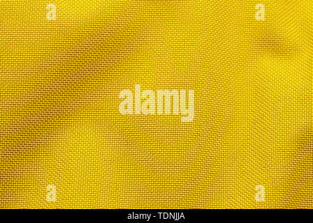 Tissu de nylon jaune Texture Background. Tissu épais pour sacs à dos et des équipements sportifs Banque D'Images