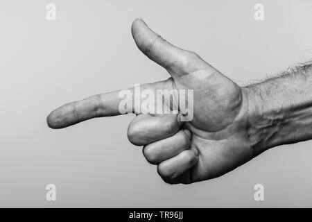 Close up of a mans hand pointing, noir et blanc. Banque D'Images