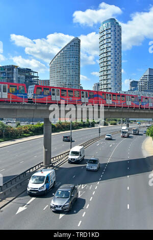 East End des tours d'immeuble gratte-ciel dominant de train sur le Docklands light railway viaduc au-dessus de la circulation sur route Tower Hamlets London UK Banque D'Images