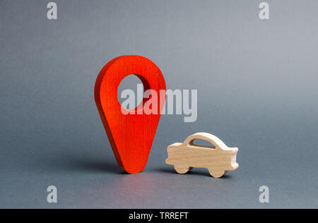 La figure de voiture et d'un marqueur de position rouge. Recherche véhicules, acheter ou vendre. Contacter la police pour trouver le voulait voiture volée. Panne de voiture et ses causes. Leg Banque D'Images