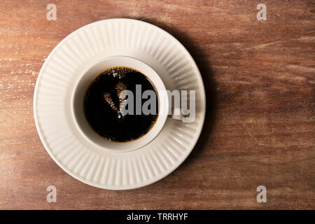 Bulles de café - onzième heure. Tasse de café bulles sur plaque avec onze heures de temps. Banque D'Images