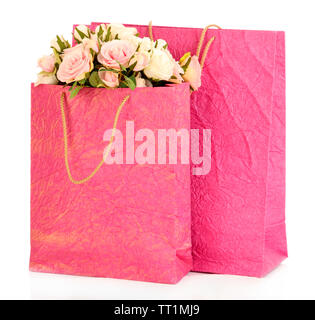 Des sacs colorés et des fleurs, isolated on white Banque D'Images
