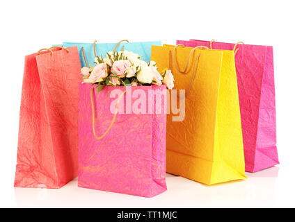 Des sacs colorés et des fleurs, isolated on white Banque D'Images