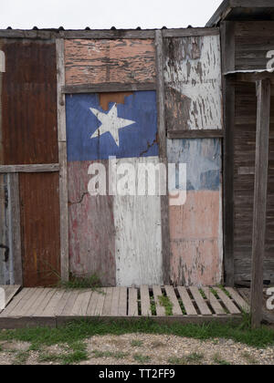 Drapeau Texas décolorées peintes sur le côté d'un ancien bâtiment dans la ville fantôme de Loraine, Texas Banque D'Images