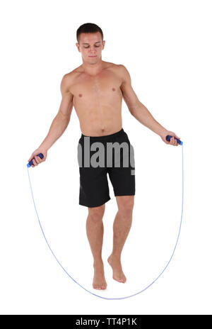 Beau jeune sportsman jumping rope isolated on white Banque D'Images