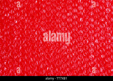 Cellophane et fond en plastique. La texture du plastique d'emballage du vieux avec des ballons. L'image des tons rouge et blanc. Banque D'Images