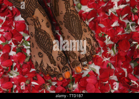 Close up of a woman feet decorated with mehendi Stock Photo