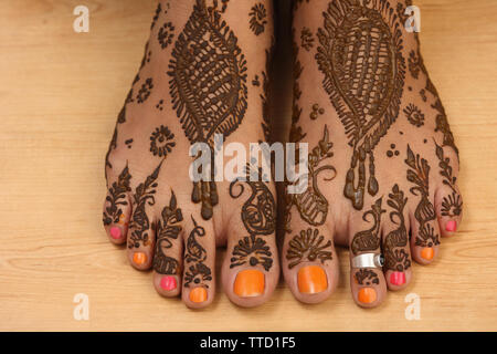 Close up of an Indian bridal feet decorated with mehendi Stock Photo