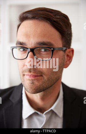 Close-up portrait of businessman at home Banque D'Images