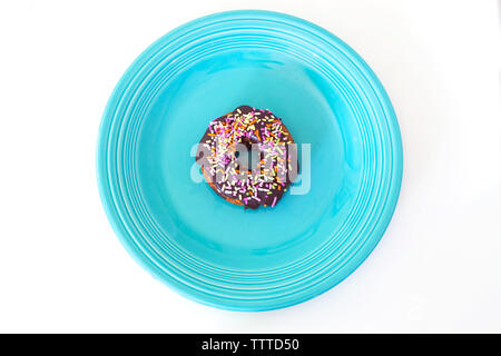 Vue de dessus de donut avec Nutrifer dans la plaque Banque D'Images