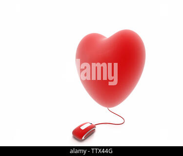 Ballon en forme de coeur attaché avec une souris d'ordinateur Banque D'Images