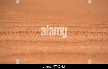 Libre tourné de belles dunes de sable du désert de sable du désert de l'ombre d'orange texture background Banque D'Images