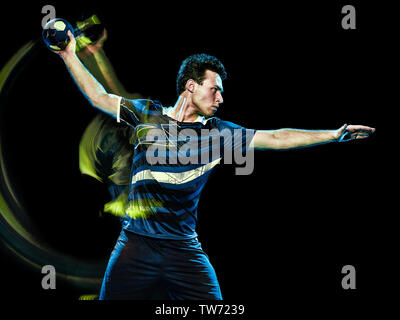 Portrait d'un joueur de handball jeune homme isolé sur fond noir avec effet peinture lumière vitesse de flou Banque D'Images