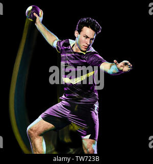 Portrait d'un joueur de handball jeune homme isolé sur fond noir avec effet peinture lumière vitesse de flou Banque D'Images