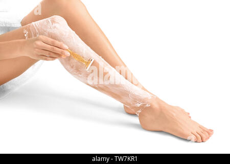 Belle femme de ses jambes, isolated on white Banque D'Images